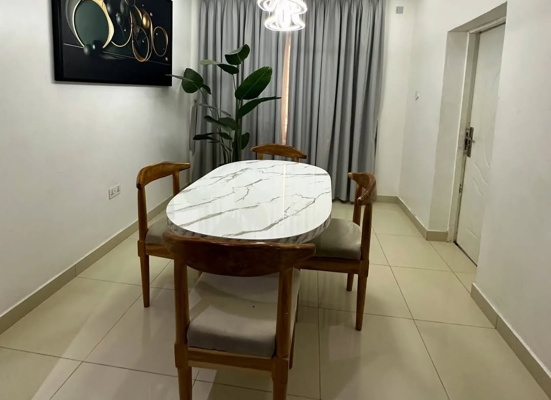 Stylishly Furnished 2-Bedroom Apartment in Prime Jahi Gilmore Location dinning room