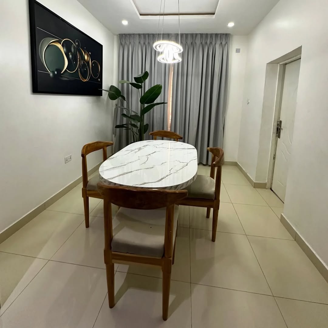Stylishly Furnished 2-Bedroom Apartment in Prime Jahi Gilmore Location dinning room